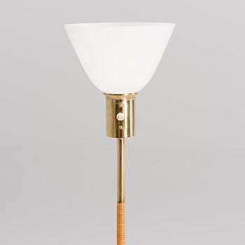 PAAVO TYNELL, A FLOOR LAMP. Manufactured by Idman.