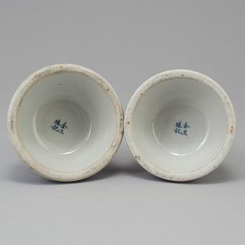 A pair of blue and white candlesticks, late Qingdynasty.
