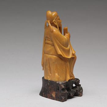 A soapstone figure of a seated scholar, late Qing dynasty, circa 1900.