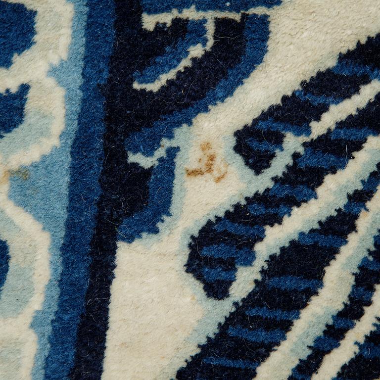 A carpet, a semi-antique China, ca 348,5-350 x 279,5-282,5 cm.