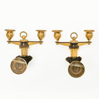 A pair of Empire patinated and ormolu two-branch appliques attr. to C. Galle (bronzier in Paris 1786-1815).