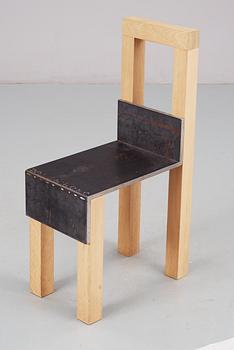 A Jonas Bohlin 'Sto' iron and oak chair, Stockholm 1990.