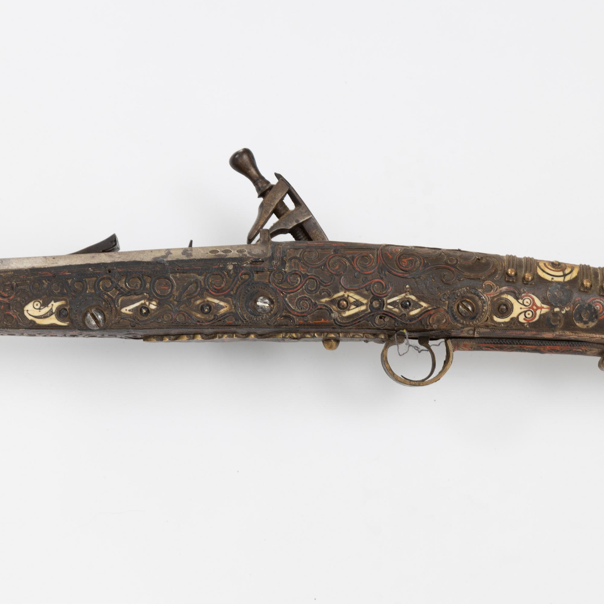 A snaphaunce gun, 19th Century.