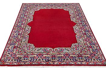 An old Kerman carpet, signed, c. 290 x 208 cm.