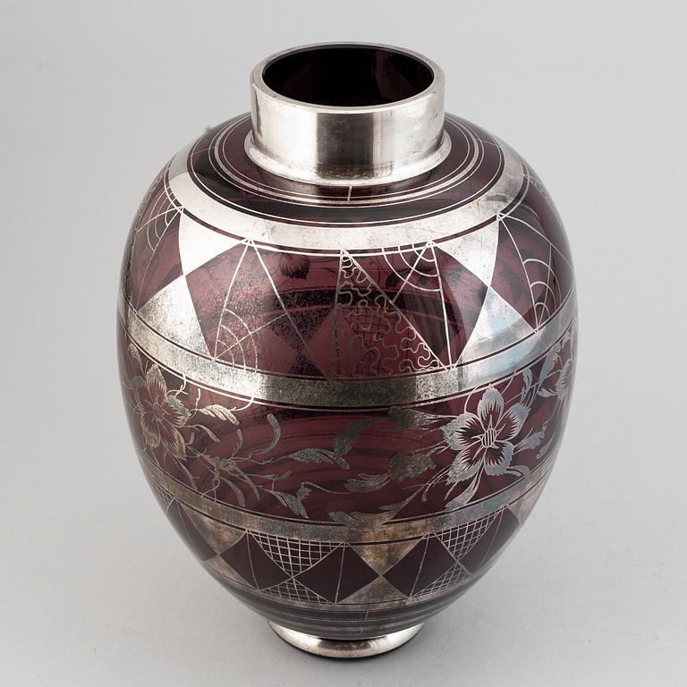 A large glass vase, probably Murano, Italy.