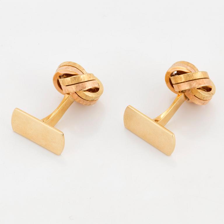 A pair of 18K two colour gold cufflinks.