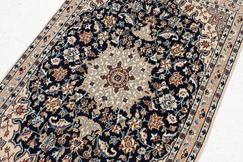 A Nain rug, part silk, c. 128 x 82 cm.