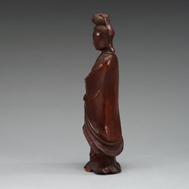 A wooden figure of Guanyin, China, early 20th Century.