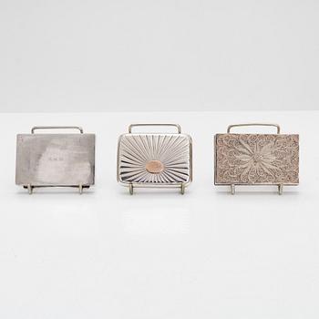 Three mid-20th-century silver cases.