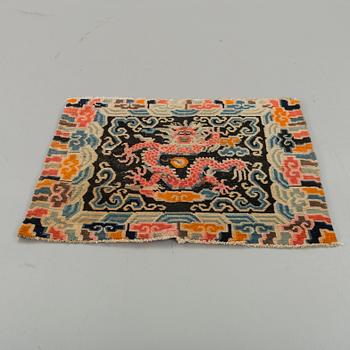 A semiantique Tibetan carpet ca 71 x 79 cm.