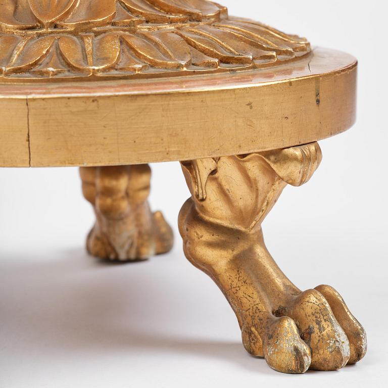 A pair of late Gustavian giltwood torchères by J. Frisk (master in Stockholm 1805-24).