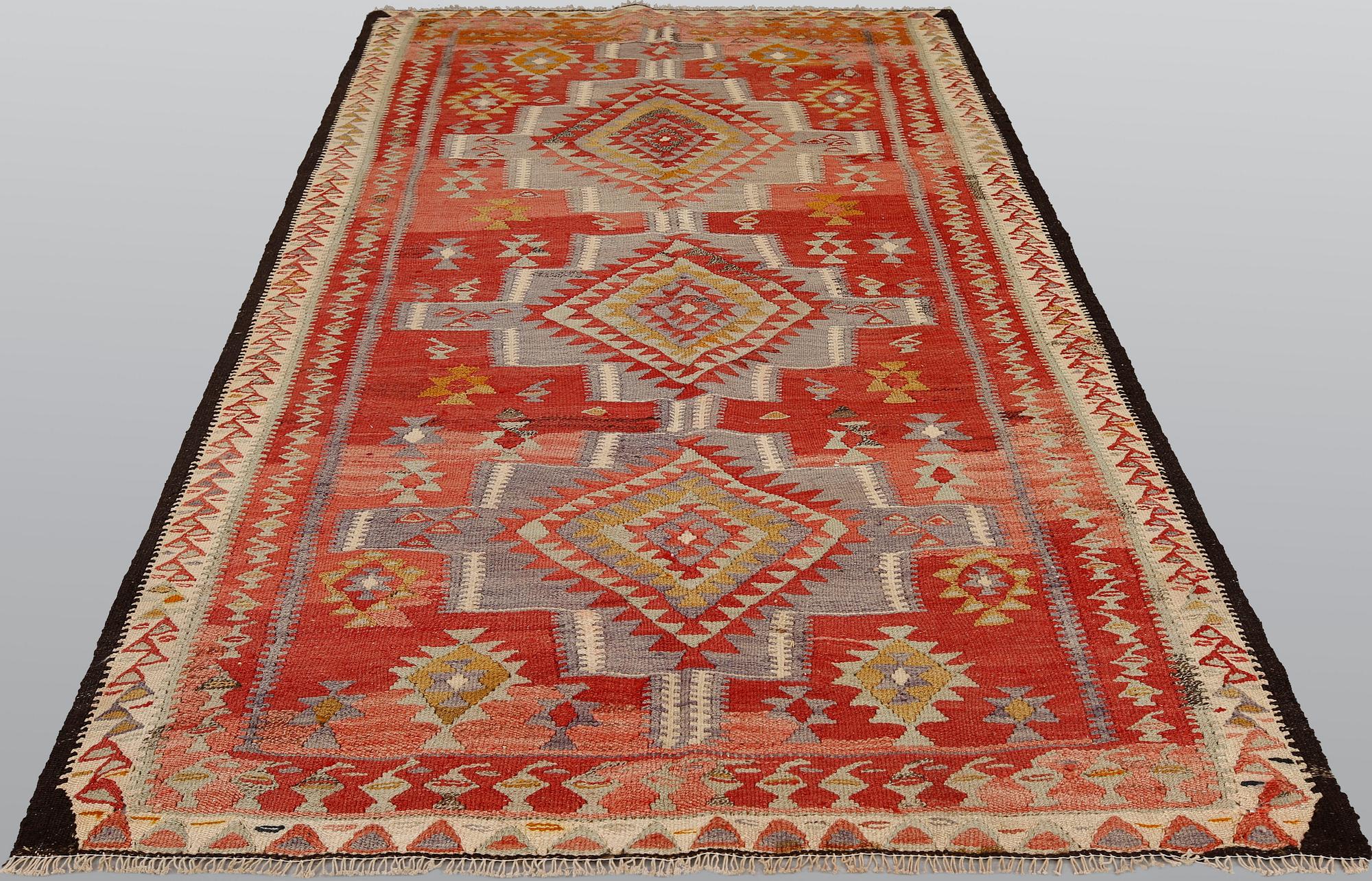A Persian nomadic kilim, approximately 260 x 150 cm.
