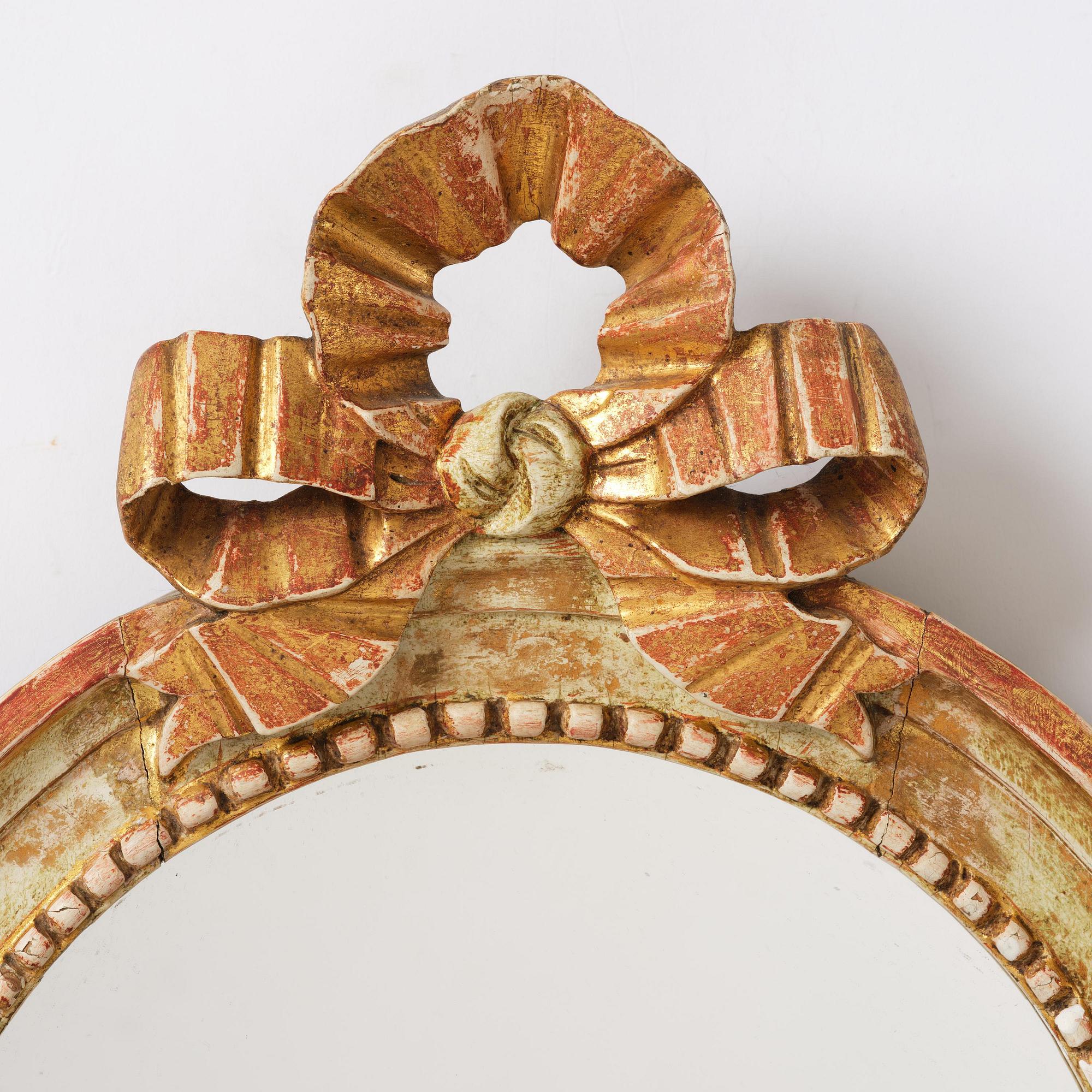A pair of Gustaviantwo-branch giltwood girandole mirrors by C. G. Fyrwald (master in Stockholm 1776-1825).