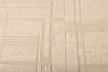 A relief-cut Moroccan carpet, c. 321 x 251 cm.