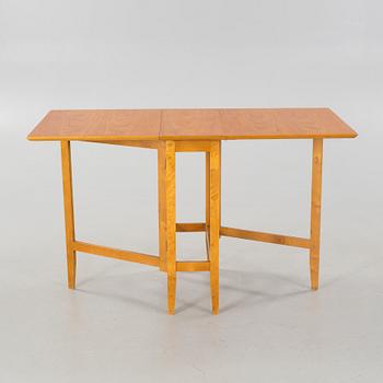 A gate-legged table by Edsbyverken in 1959.