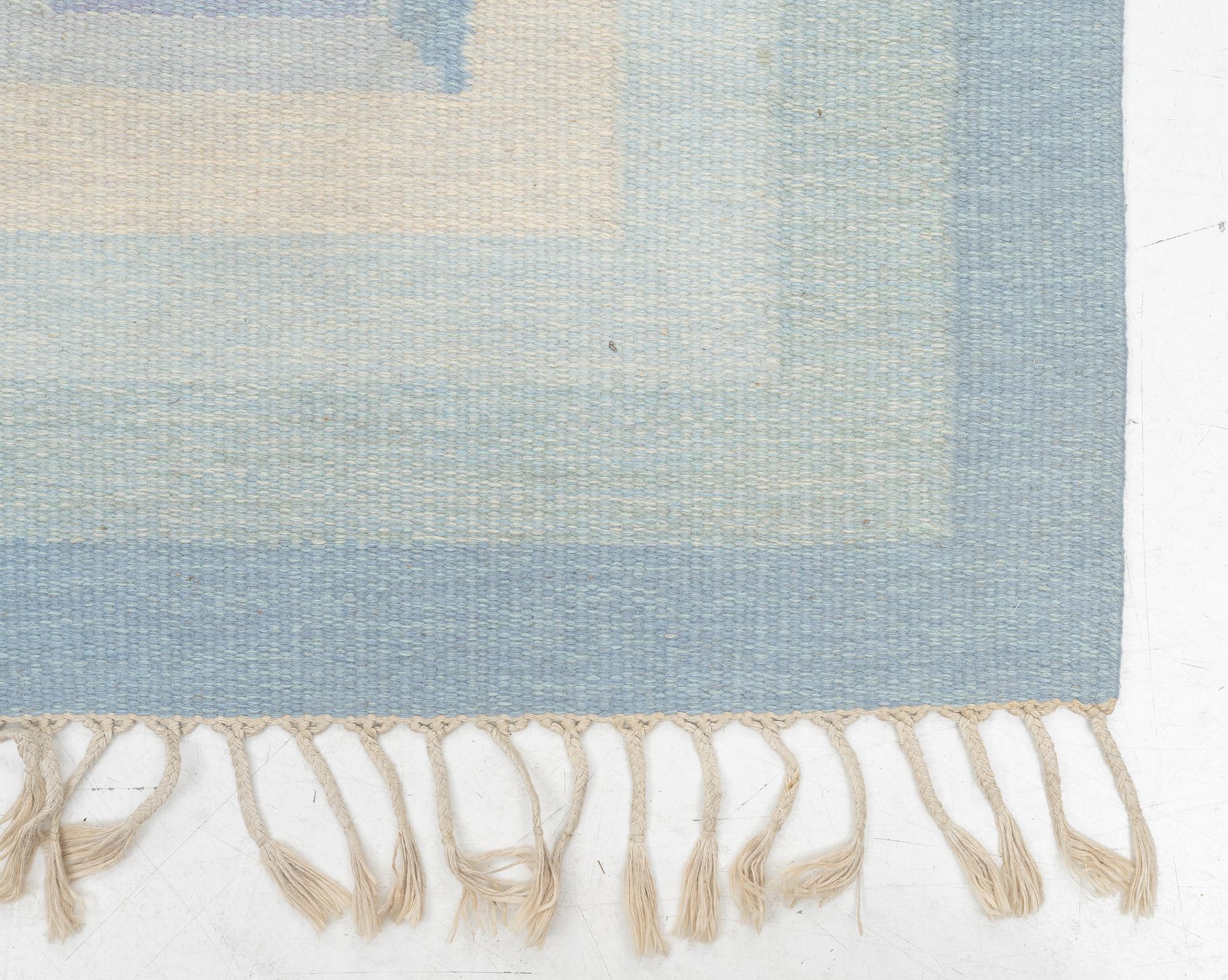A flat weave rug, c. 240 x 163 cm.