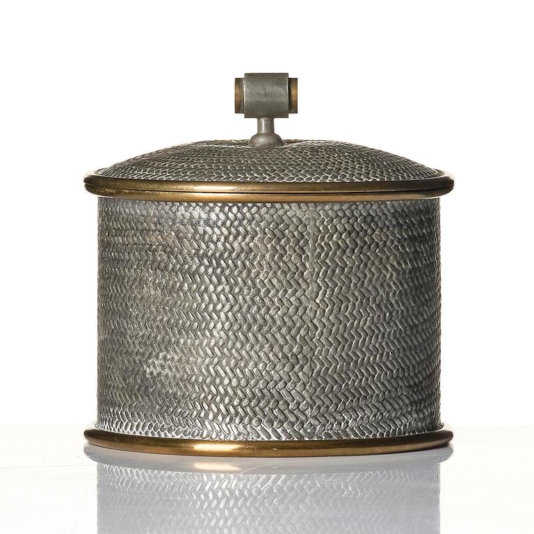 Björn Trägårdh, a pewter and brass lidded jar, model "A 2273", Firma Svenskt Tenn, Stockholm, 1944.