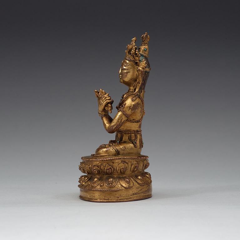 A gilt copper alloy figure of Vajradhara, possibly Tibet, 15/16th Century.