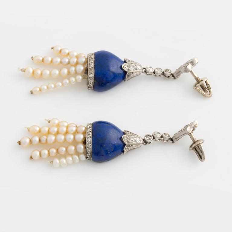 Earrings, with lapis lazuli, old-cut diamonds, and tassels with pearls.