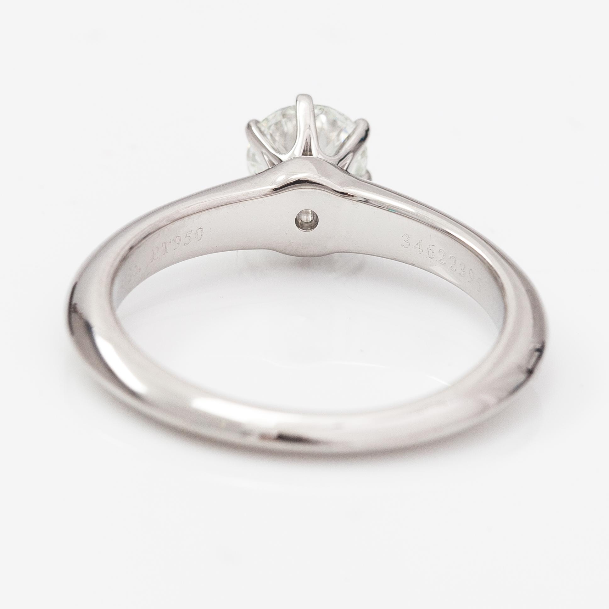 Tiffany & Co, A platinum ring with a ca. 0.55 ct diamond.
