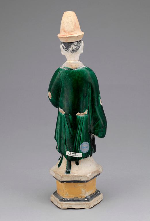A green and yellow glazed potted figure of a Dignitary, Ming dynasty (1368-1644).
