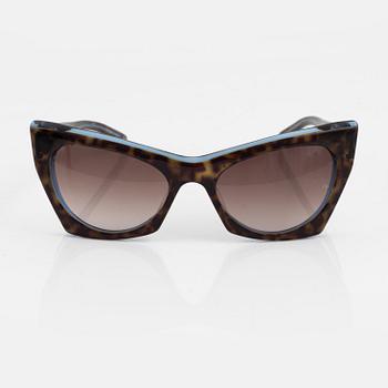 Oliver Goldsmith, a pair of electric tortoise "Orbison" sunglasses.