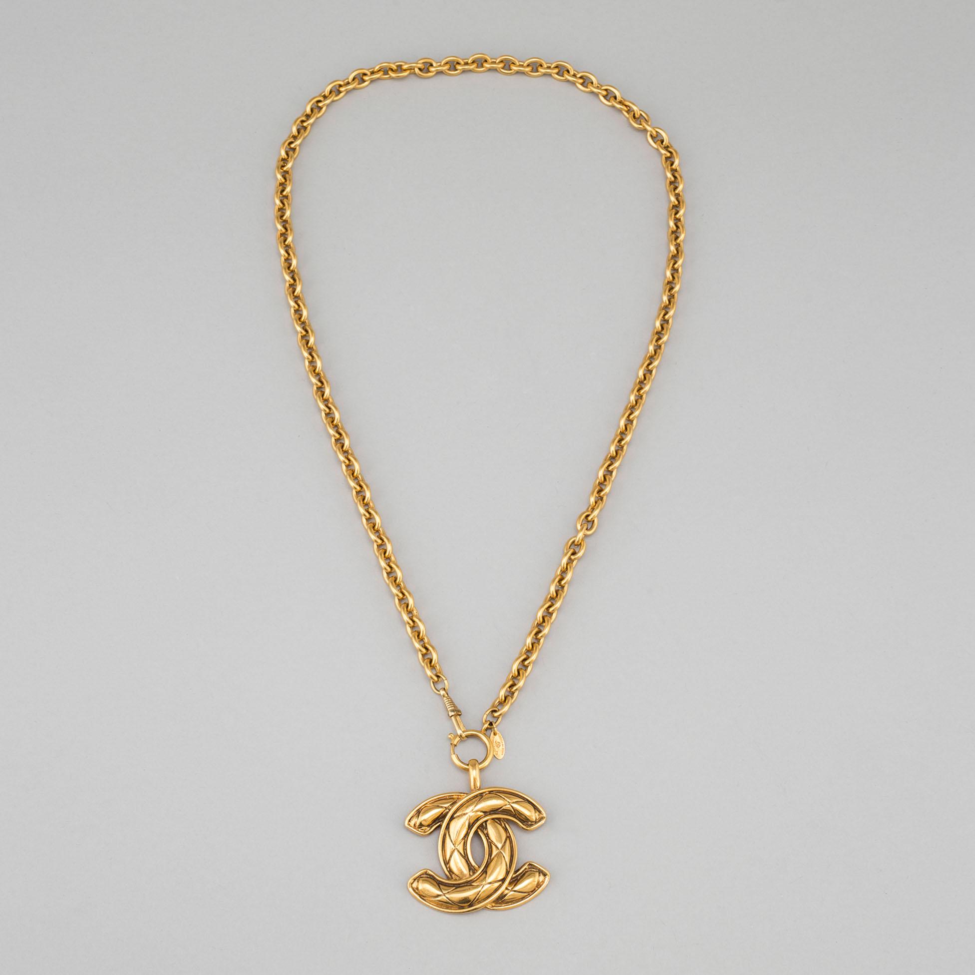 CHANEL, a metal necklace/belt.