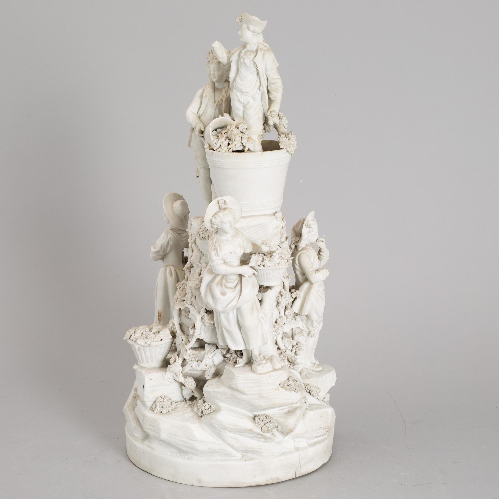 A biscuit porcelain figure group, circa 1900.
