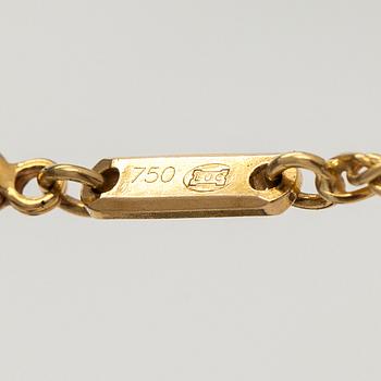 Chopard, an 18K gold 'Happy Diamonds' necklace with brilliant-cut diamonds.