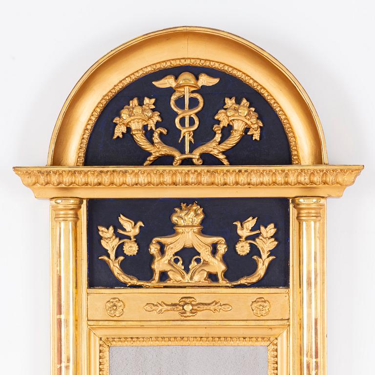 An Empire mirror, first half of the 19th Century.