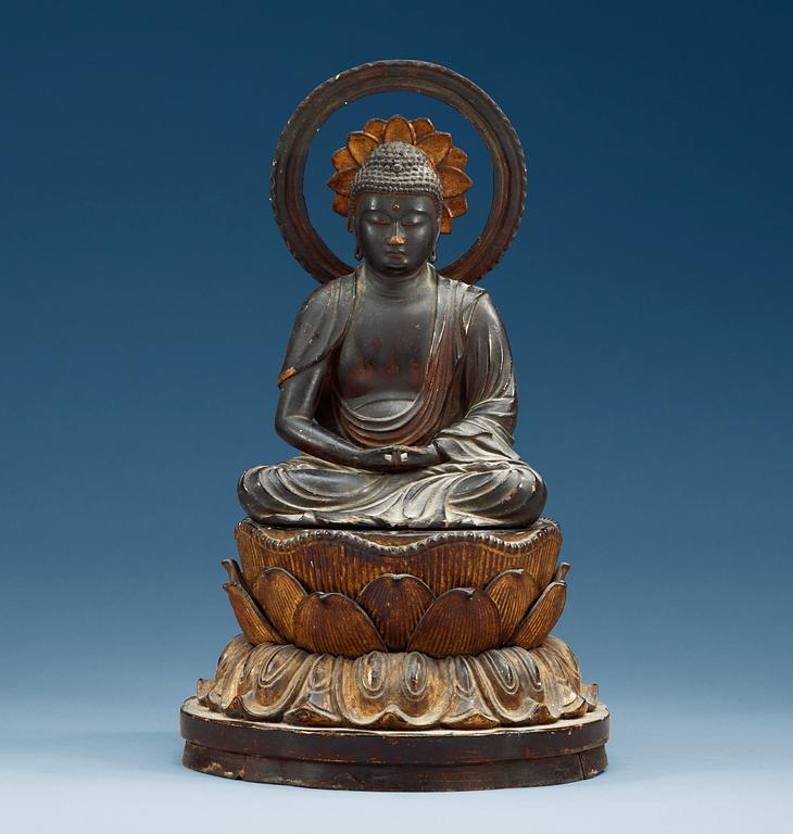 A Japanese gilt lacquer figure of a seated Buddha with his hands in Dhyana Mudra on a double lotus throne, 19th Century.
