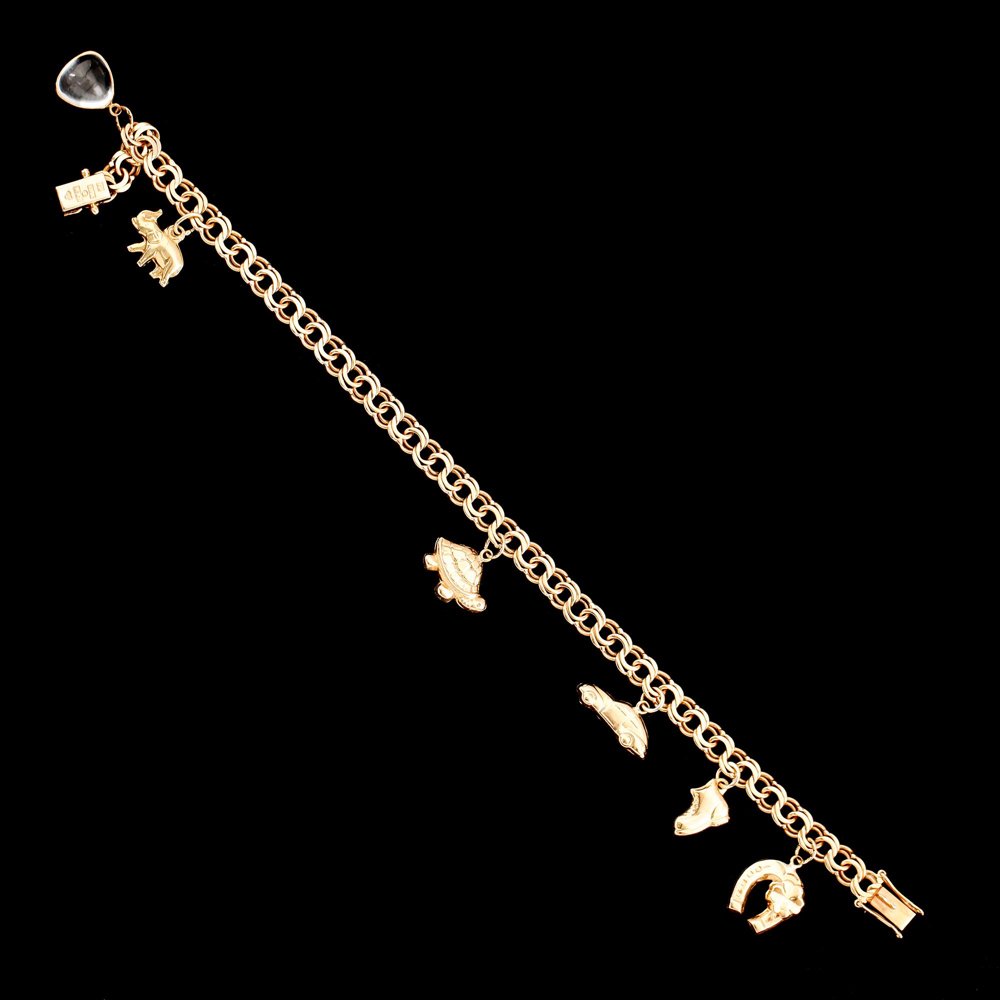 BERLOCKARMBAND, 18 k guld, 1959, bismarcklänk. Vikt ca 13 gram.