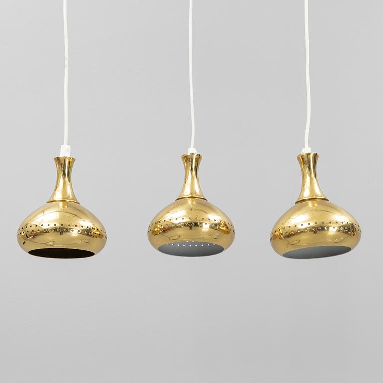 A set of three brass pendule lights, second half of the 20th Century.