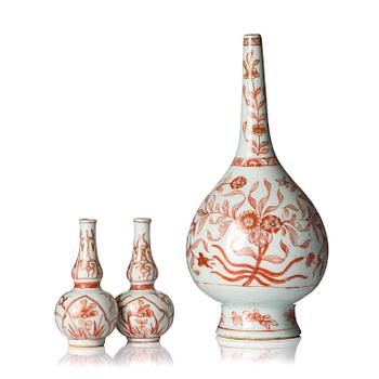 1138. A set of three iron-red decorated water droppers, Qing dynasty, Kangxi (1662-1722).