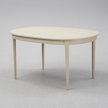 A dining table with two armchairs and six chairs by Carl Malmsten for Bodafors.