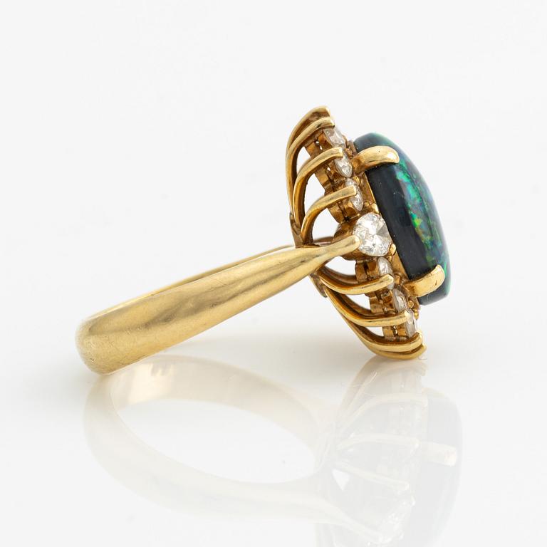 Ring, gold with opal and brilliant and drop-cut diamonds.