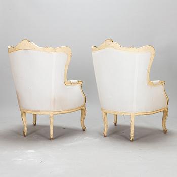 A pair of louis quinze style bergerer armchairs, first part of the 20th century.