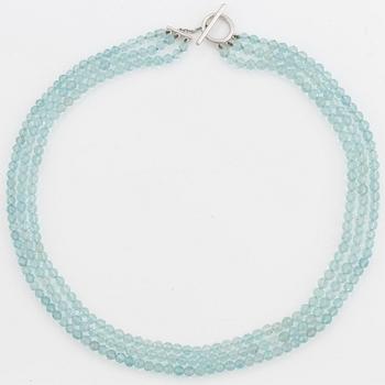 A Tiffany & Co three strand faceted aquamarine bead necklace with an 18K white gold clasp.