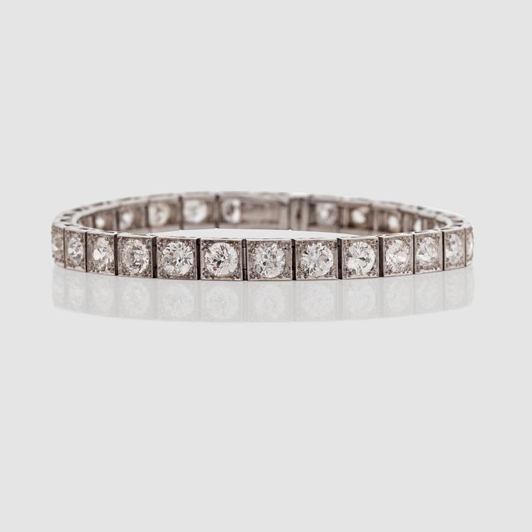 An old-cut diamond, ca 10 cts, line bracelet. Quality circa H/SI.