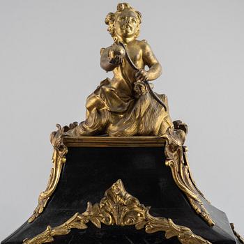 Clock, Rococo style with partially older parts, around the year 1900.