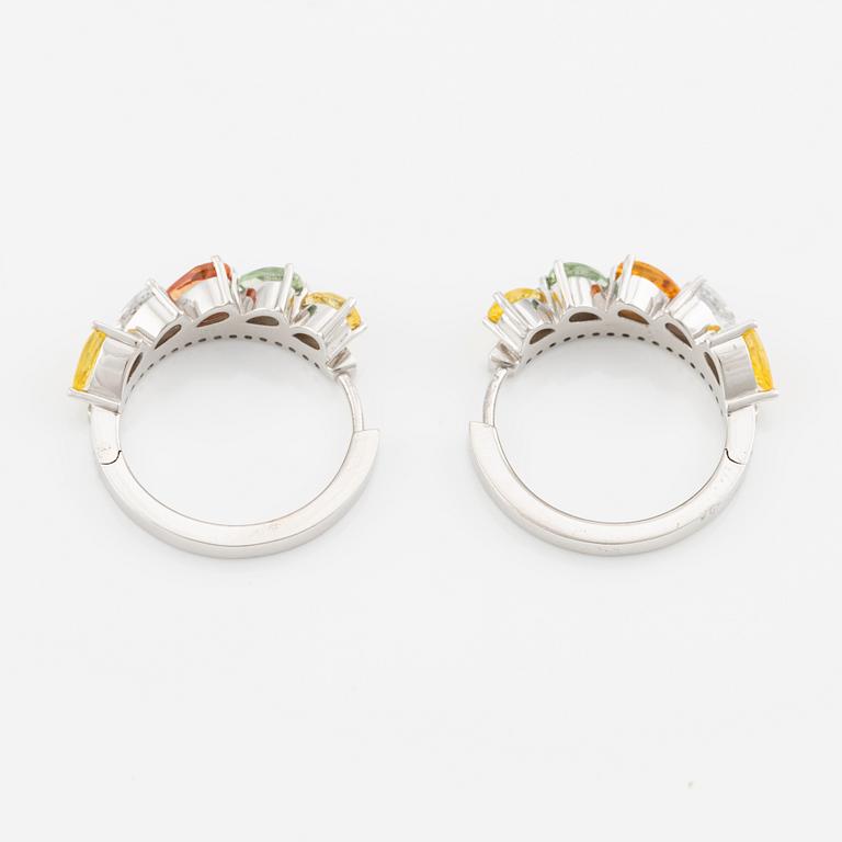 A pair of 14K gold earrings with multicoloured sapphires and diamonds.