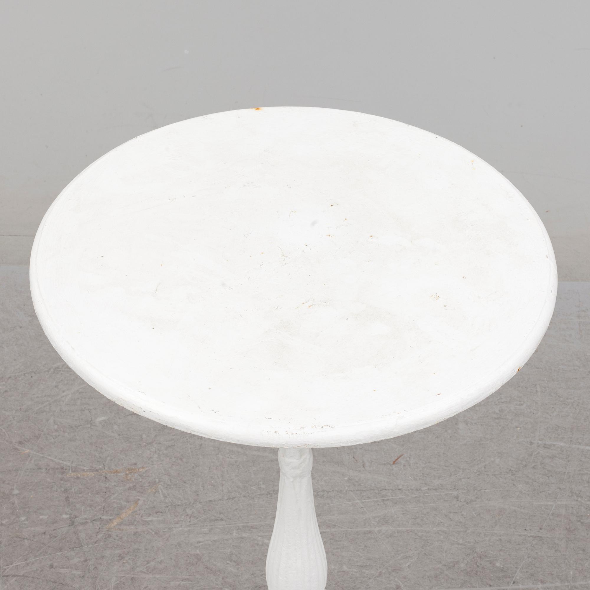 an early 20th century cast iron table.