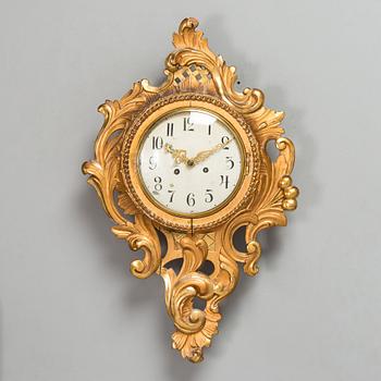 A Rococo style wall clock from first half of the 20th century.