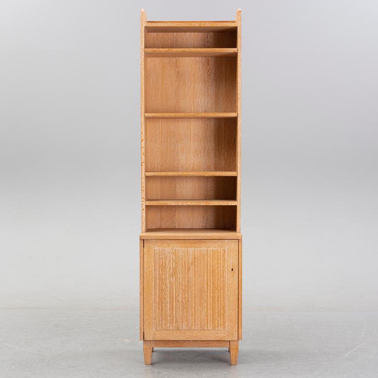 An oak book case with a cabinet, second half of the 20th Century.