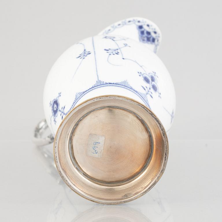 A 'Blue Fluted Half Lace' / 'Musselmalet' porcelain decanter with metal fittings, Royal Copenhagen, 19th century.