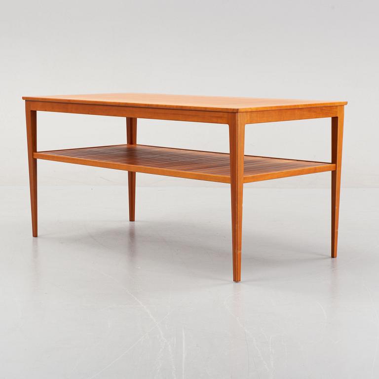 A 'Wetter' walnut coffee table by Carl Malmsten.