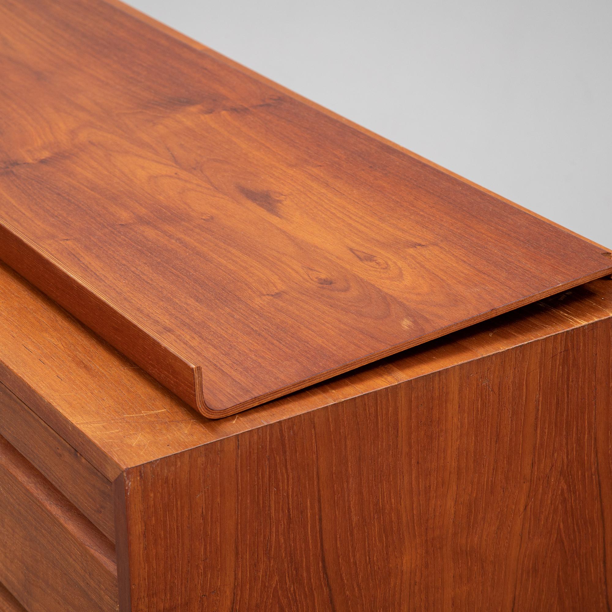 A 1960's teak shelving system by Poul Cadovius.