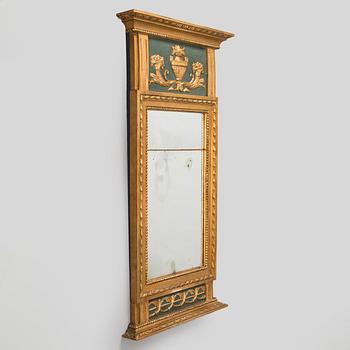 An Empire mirror, first half of the 19th century.