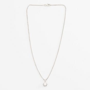 Pendant with chain in 18K gold and a round brilliant-cut diamond.