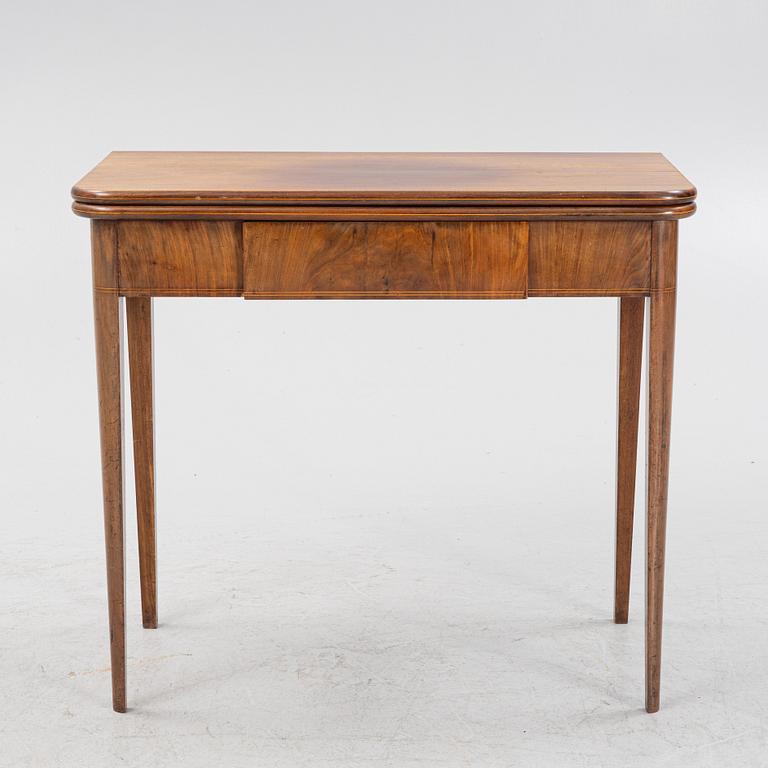 A mahogany games table, early 19th Century.